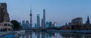 city skyline across body of water during daytime